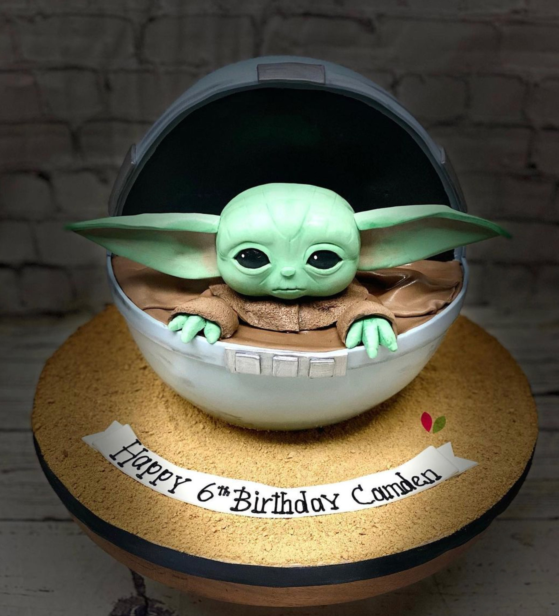 A baby yoda cake for a 6th birthday