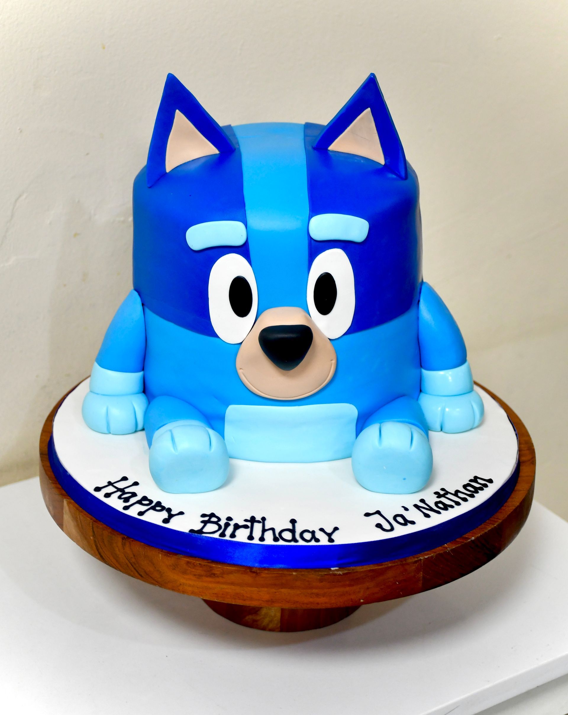 A birthday cake with bluey on it