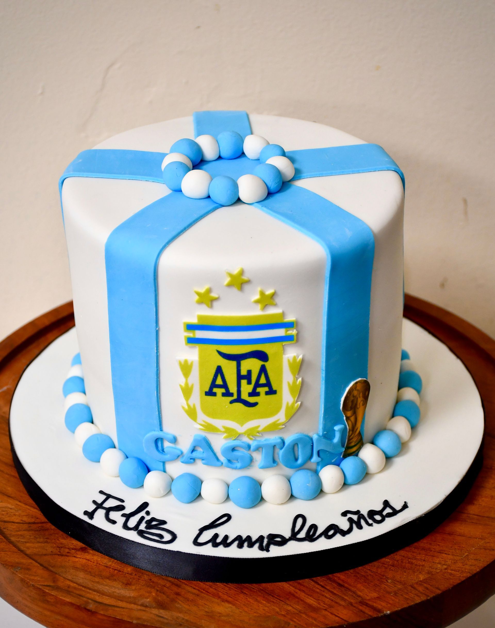 A birthday cake with the letters ata on it