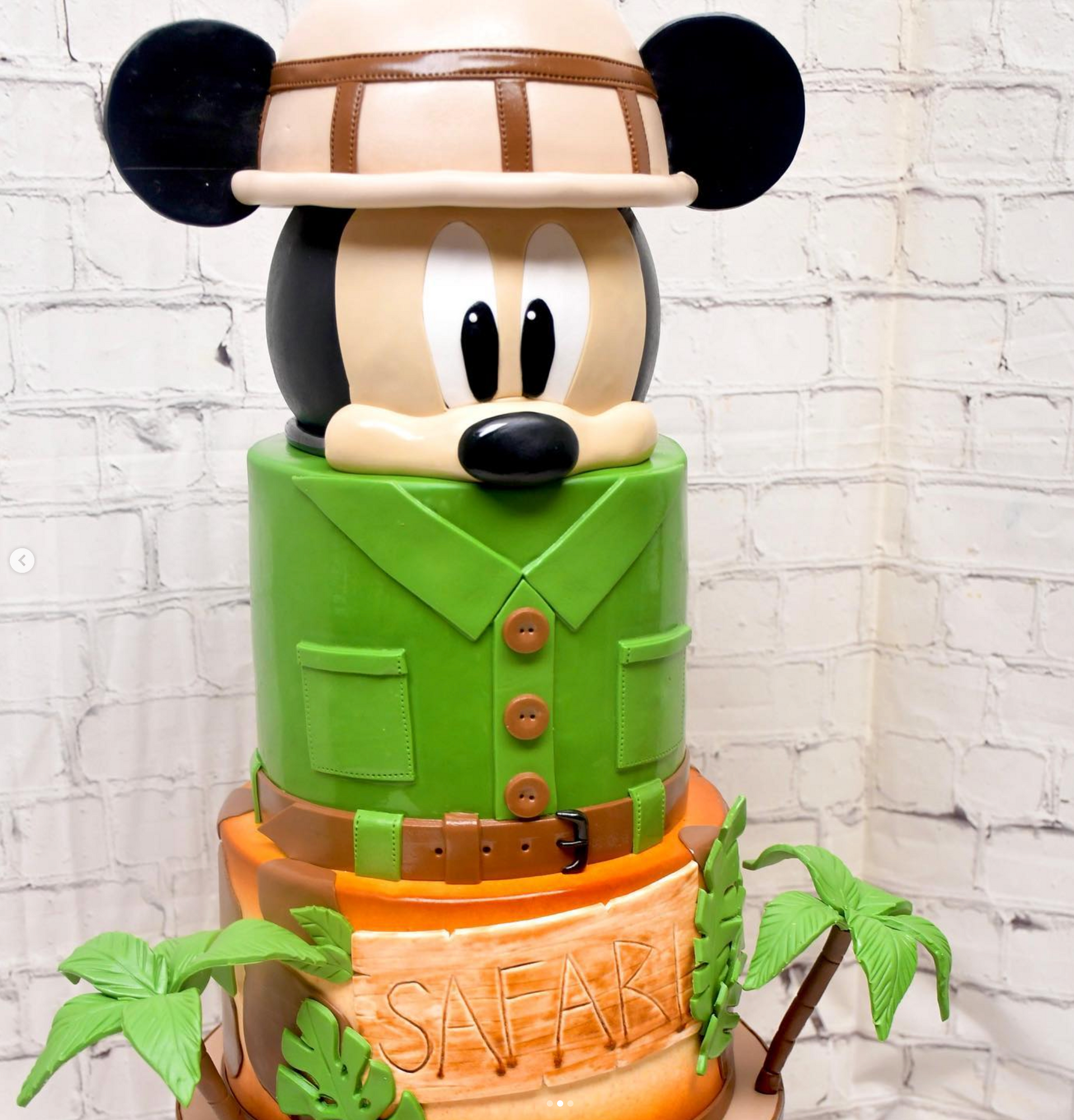 A mickey mouse cake is stacked on top of each other