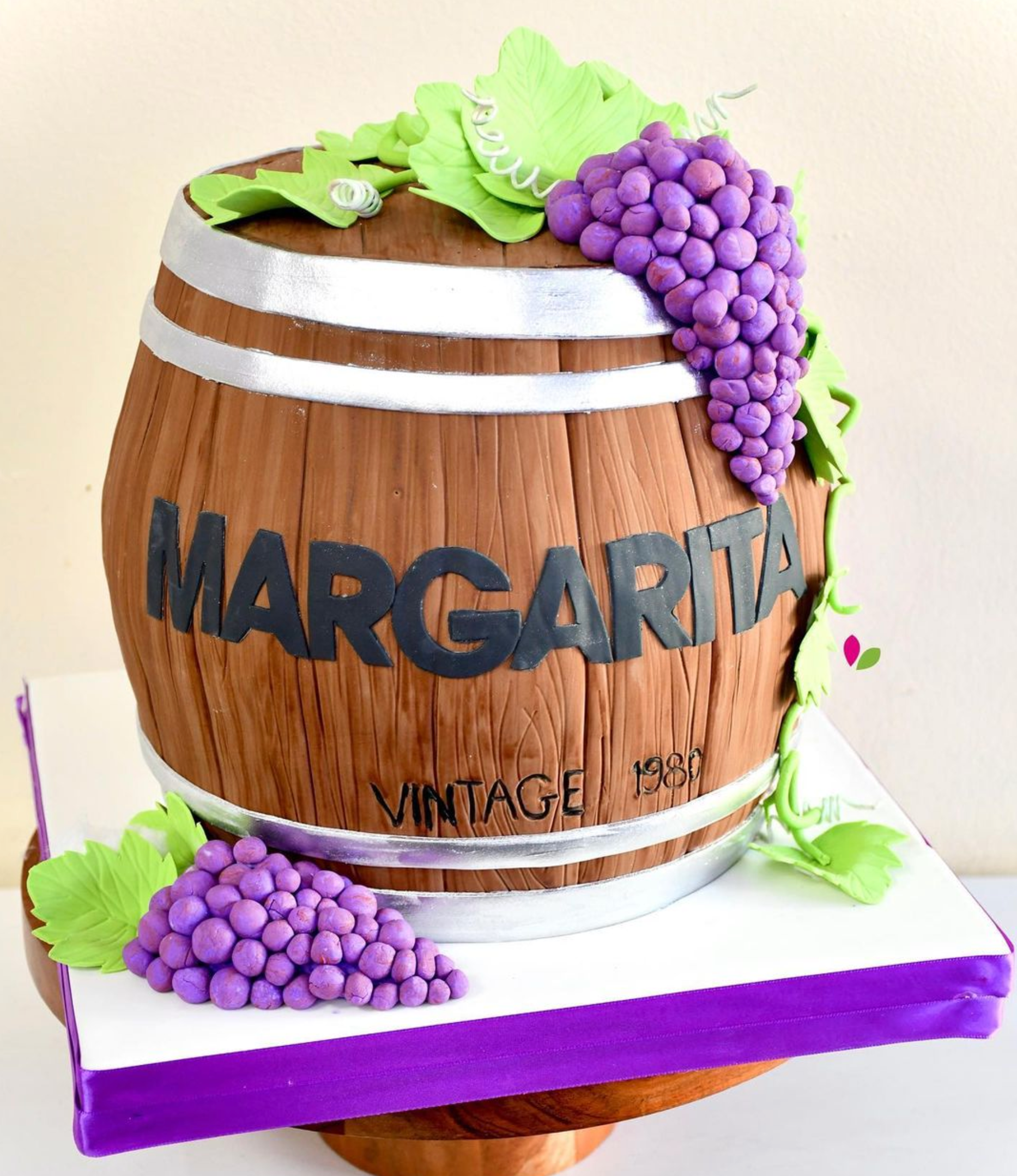 A wooden barrel with the word margarita on it