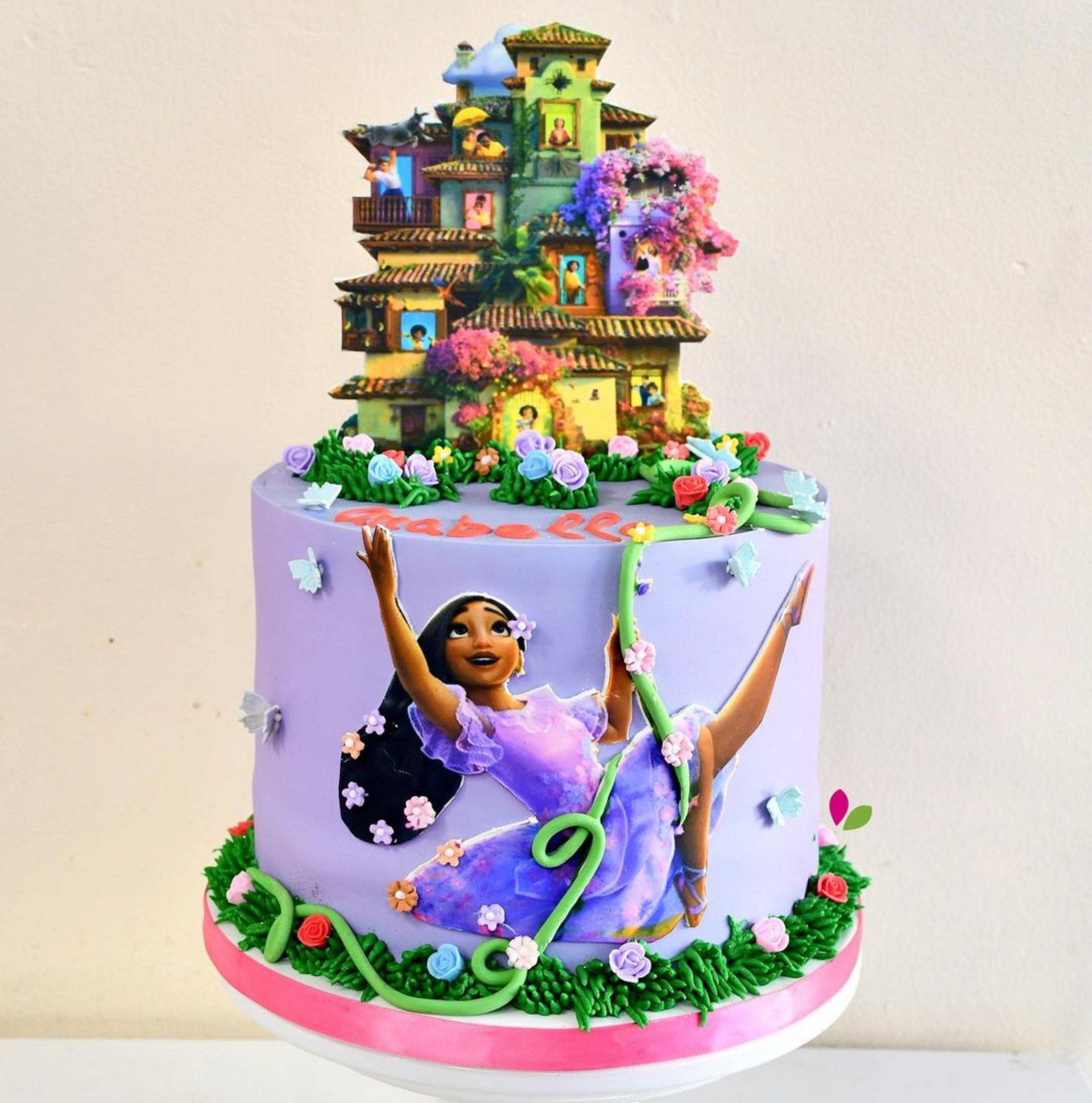 A purple cake with a picture of a girl on it