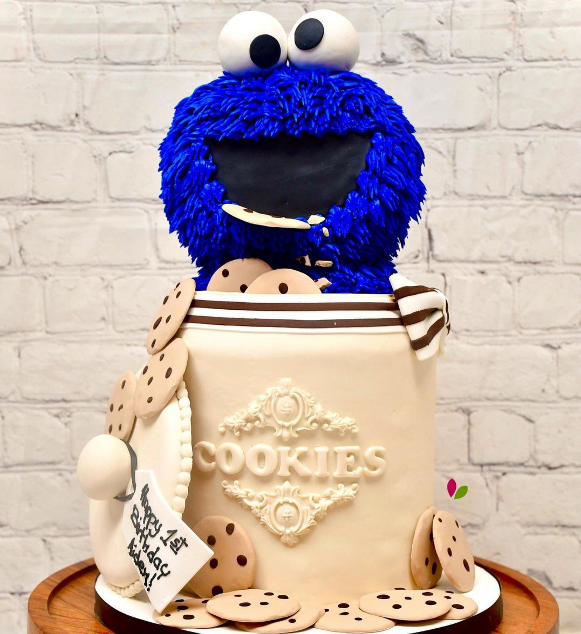 A cake with a cookie monster in a cookie jar