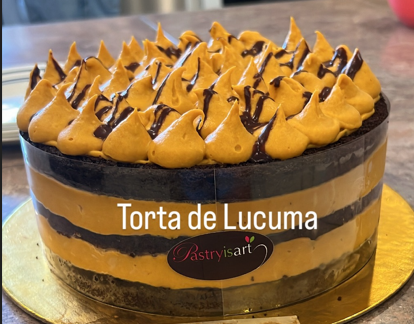 A torta de lucuma cake with chocolate frosting on top