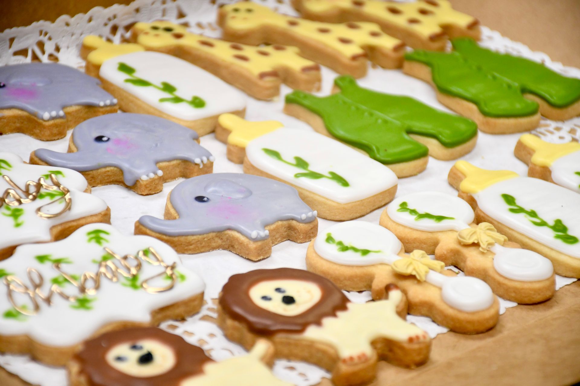 A tray of decorated cookies in the shape of animals