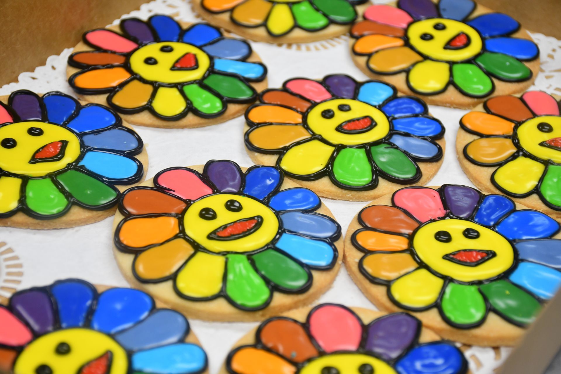 A bunch of colorful cookies with smiley faces on them