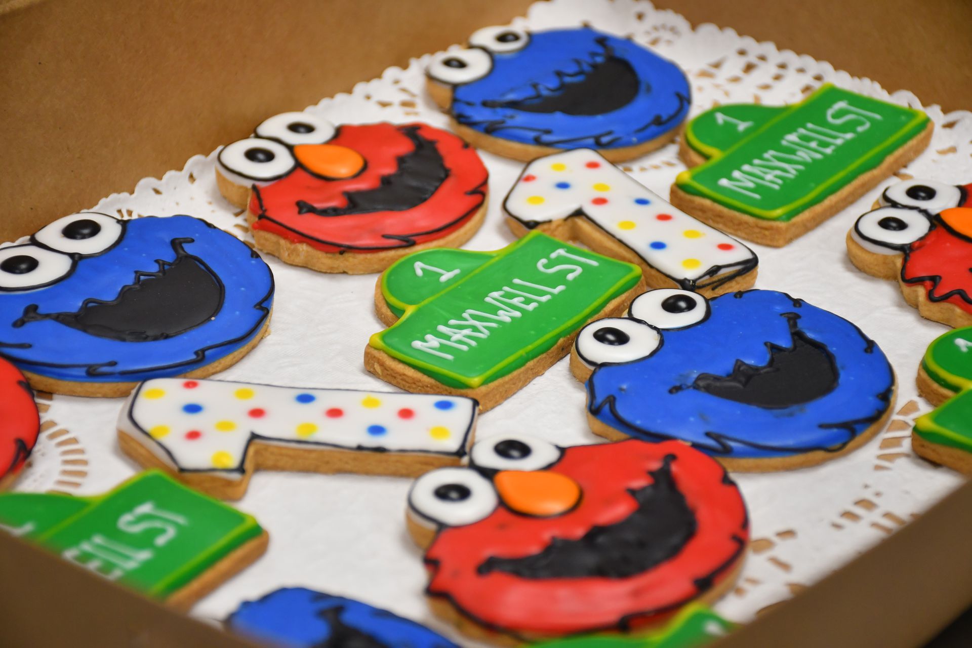 A box of sesame street cookies with elmo and cookie monster on them