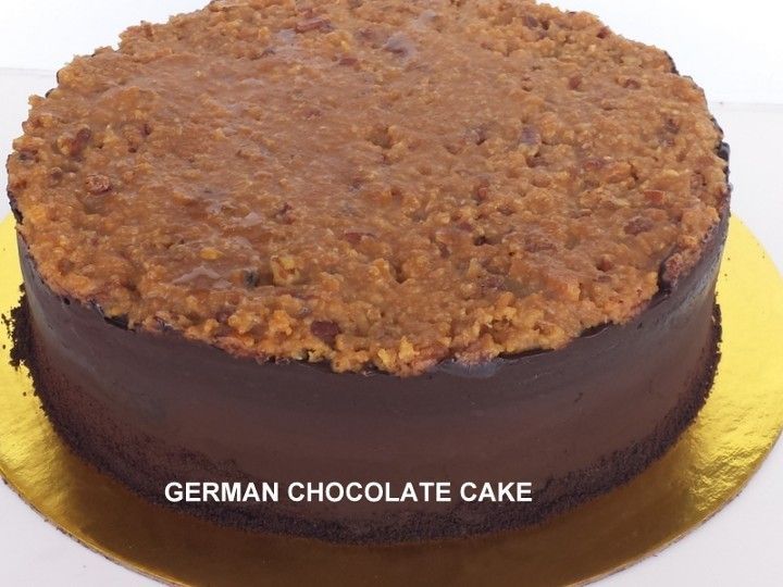 A german chocolate cake is on a gold plate