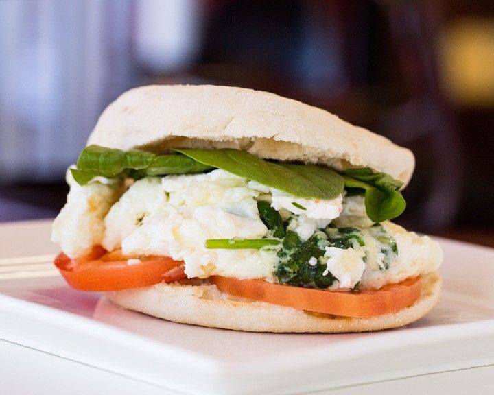 A close up of a sandwich on a white plate