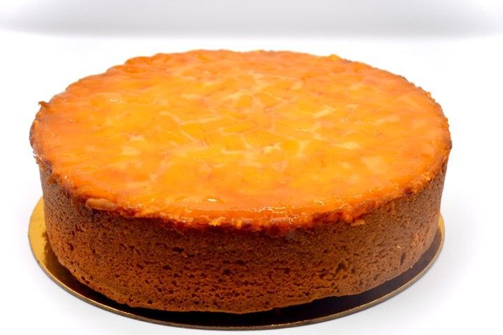 A cake with orange icing on top of it