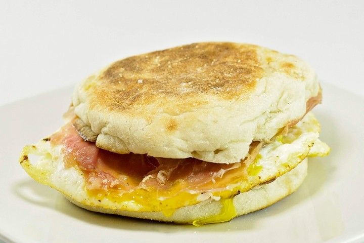 A close up of a breakfast sandwich on a plate