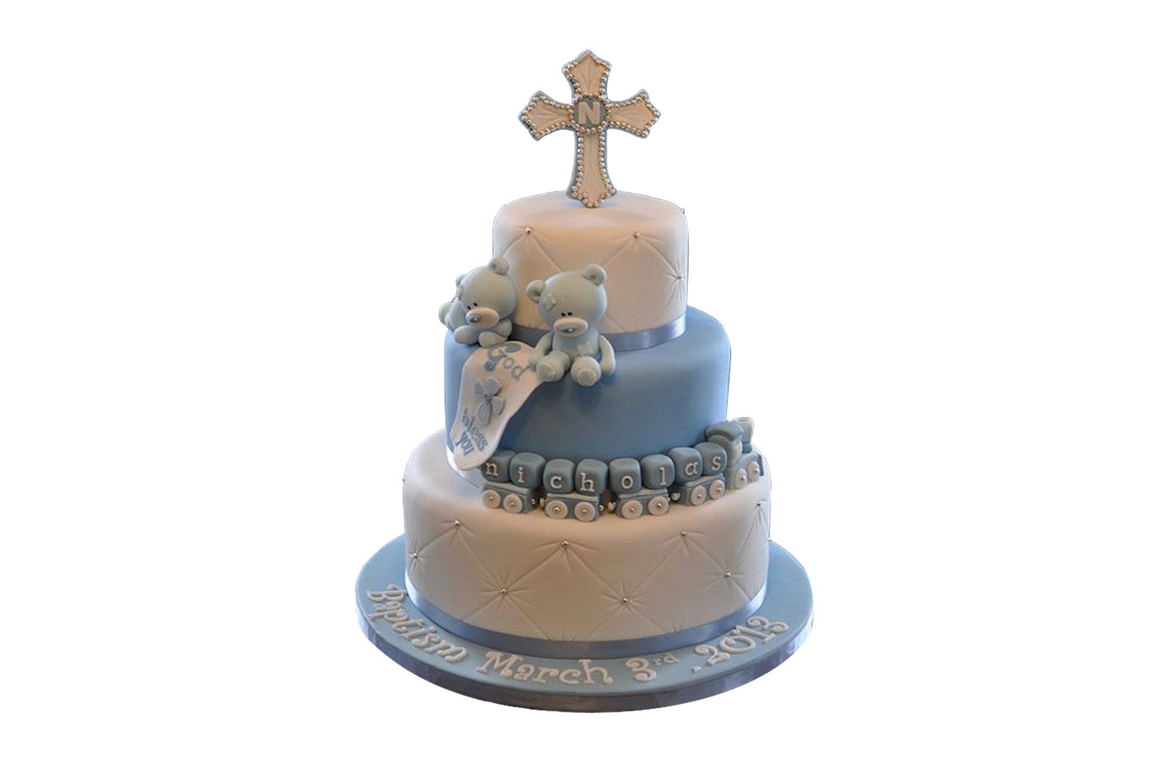 A three tiered cake with a cross on top of it.