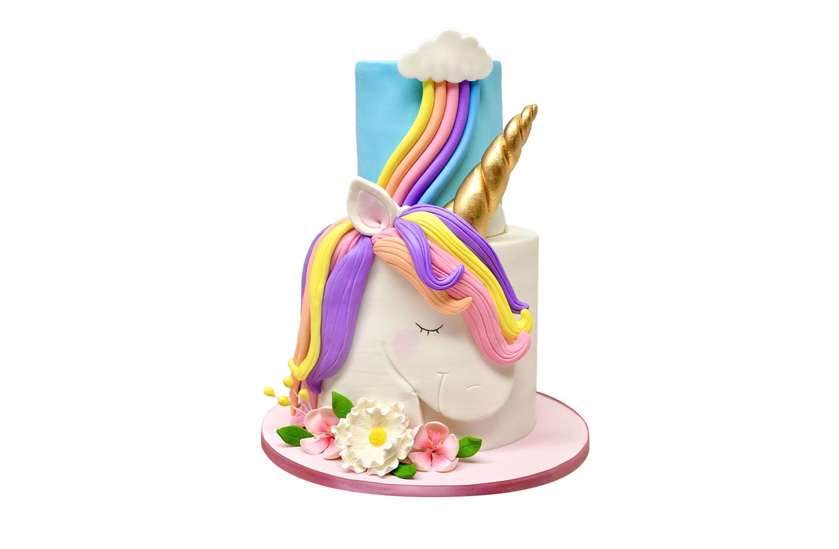 A unicorn cake with a rainbow and a unicorn horn on top of it.