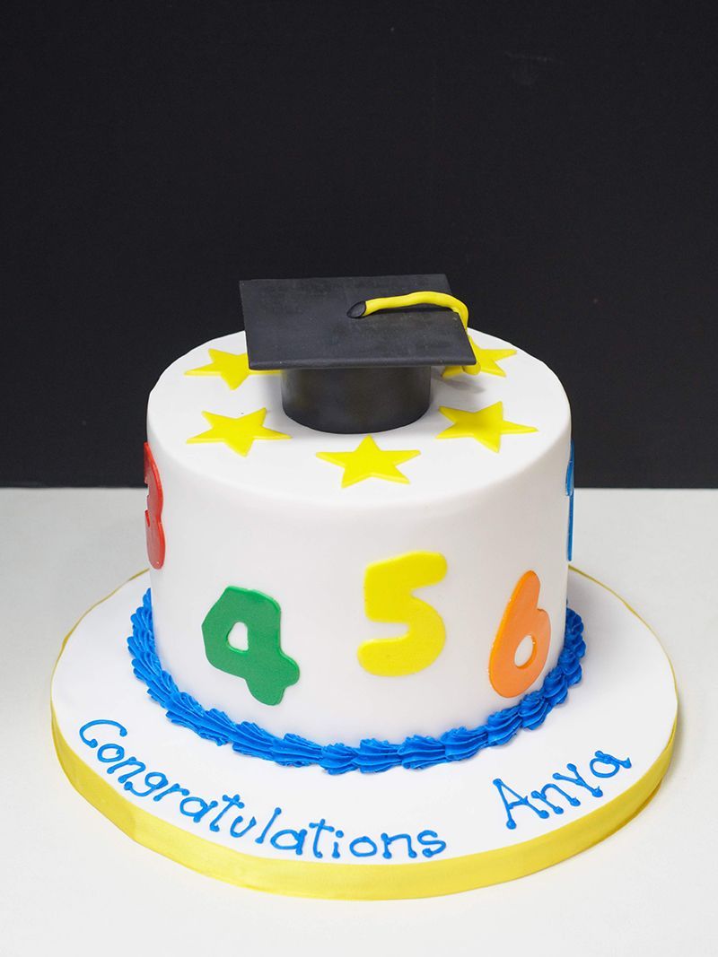 A cake that says congratulations anya on it