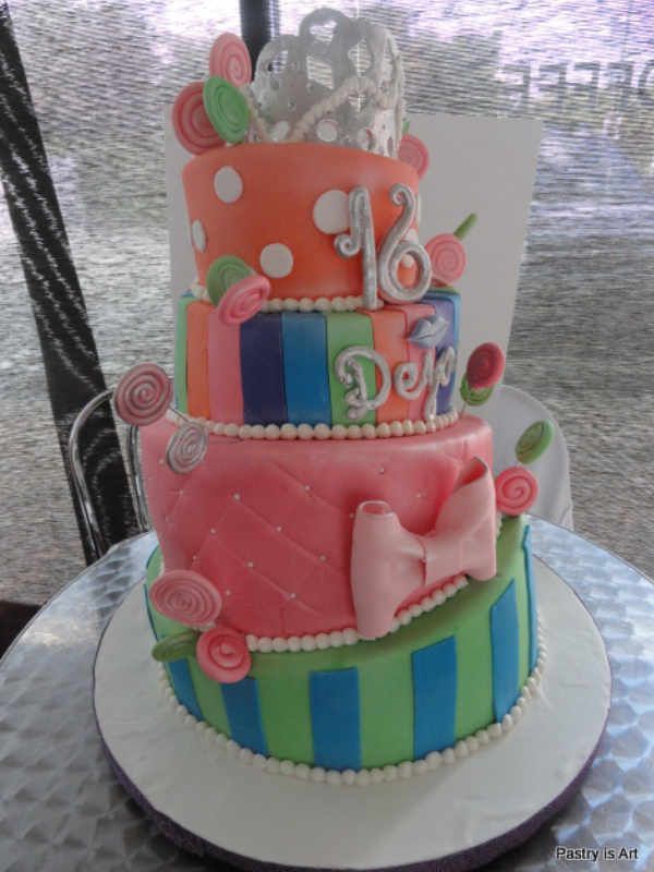 A colorful cake with the number 16 on it