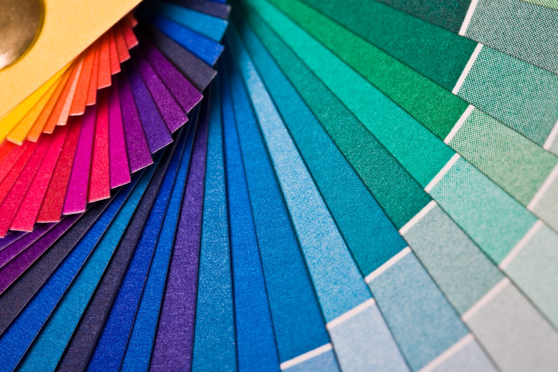 A fan shaped display of different colors of fabric