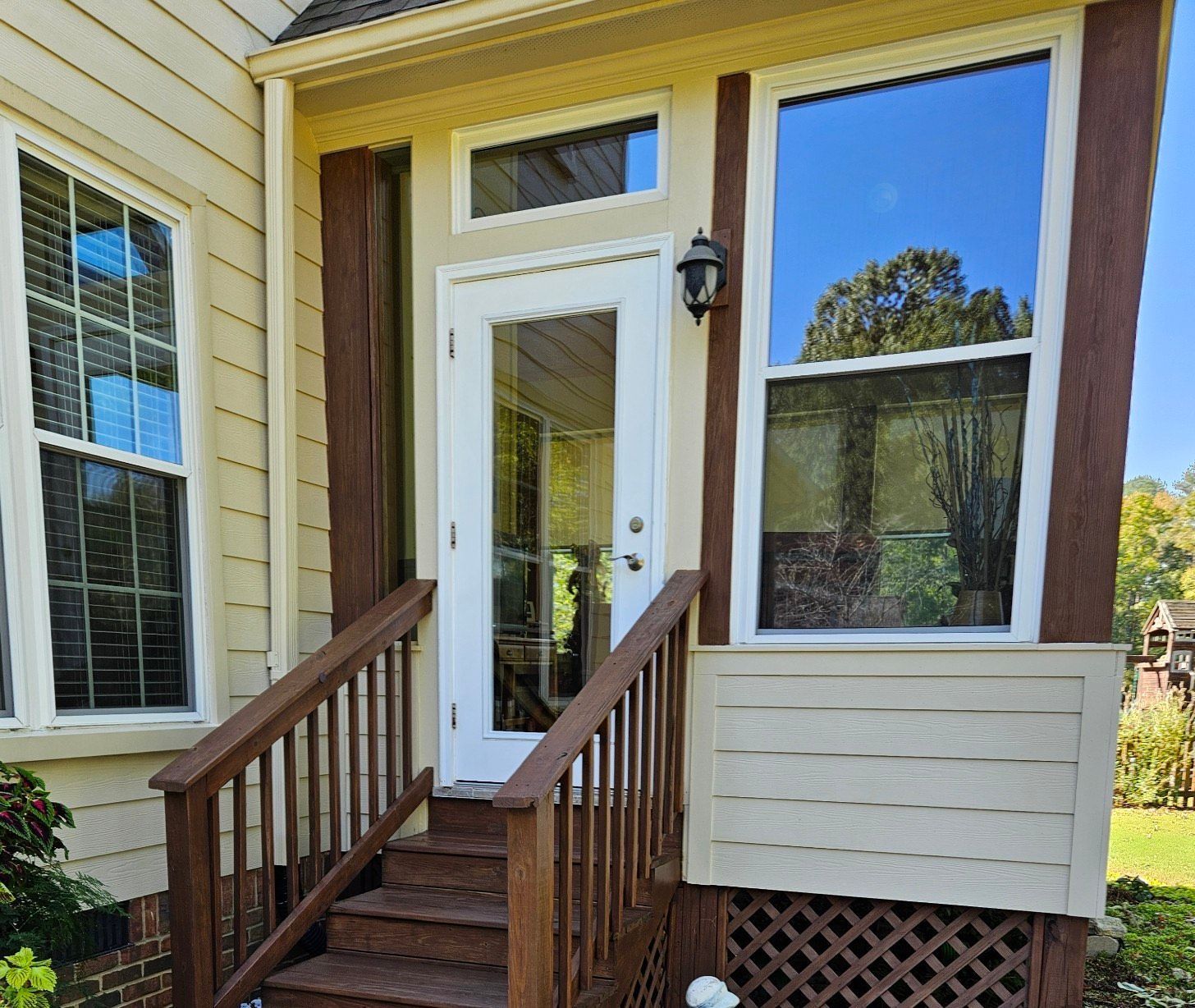 A house with a porch and stairs leading up to it