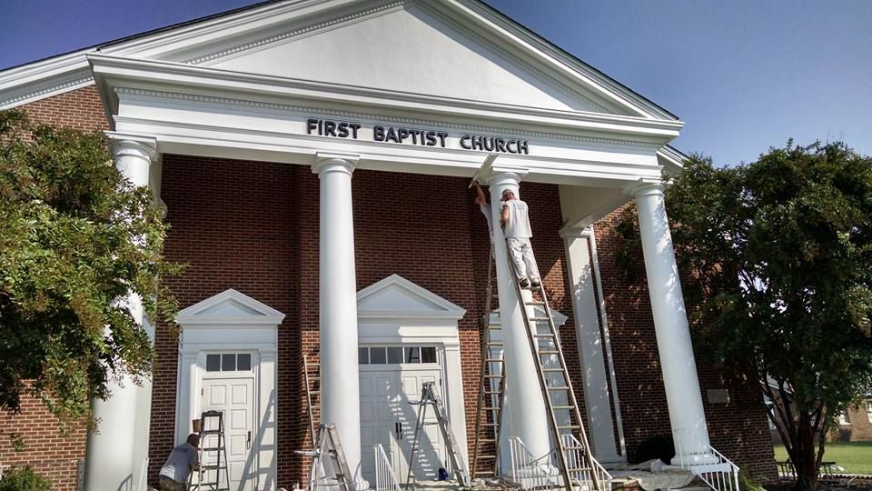 The first baptist church is being painted white