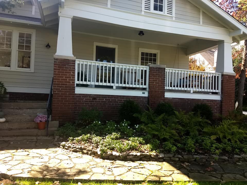 A house with a porch and a white railing