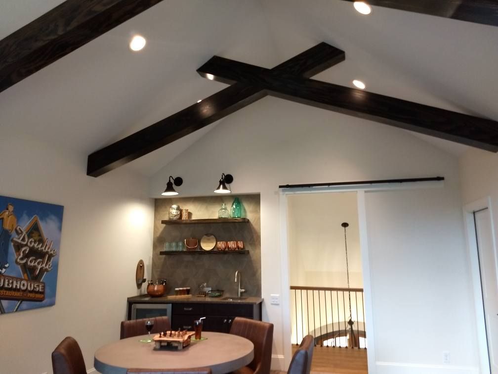 A room with a table and chairs and a sign that says dinner eagle