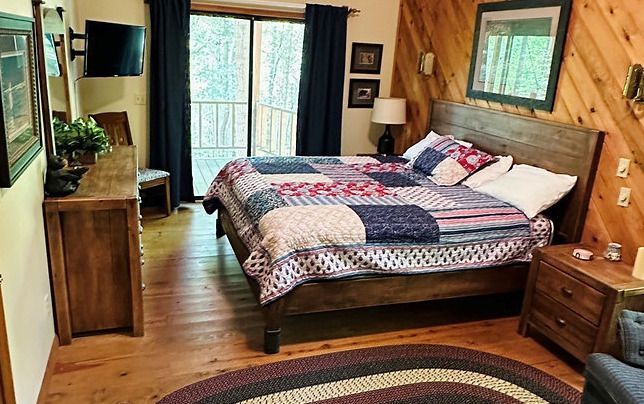 There is a large bed in the middle of the room.