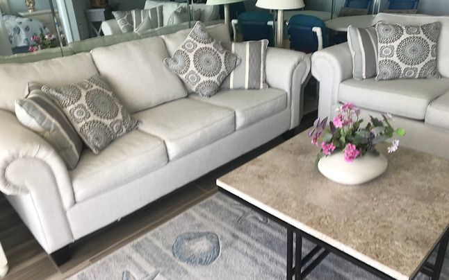 A living room with a couch and a coffee table