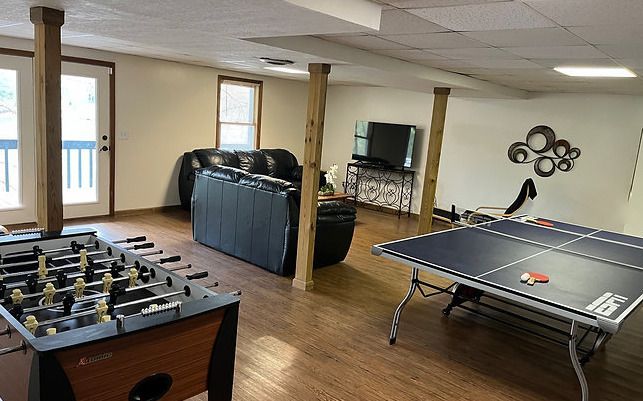 There is a ping pong table in the middle of the room.