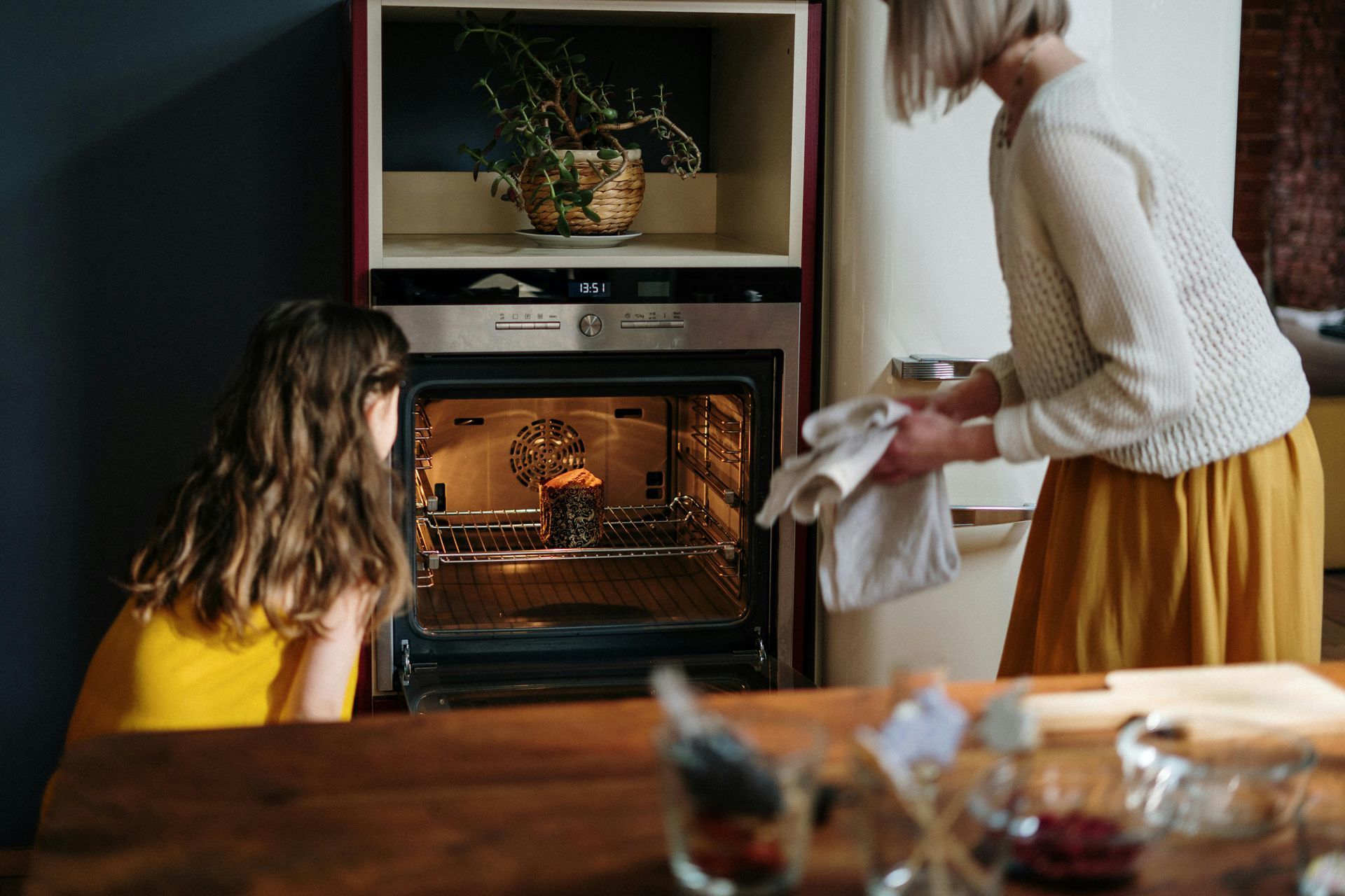 Family using the oven in cooking 