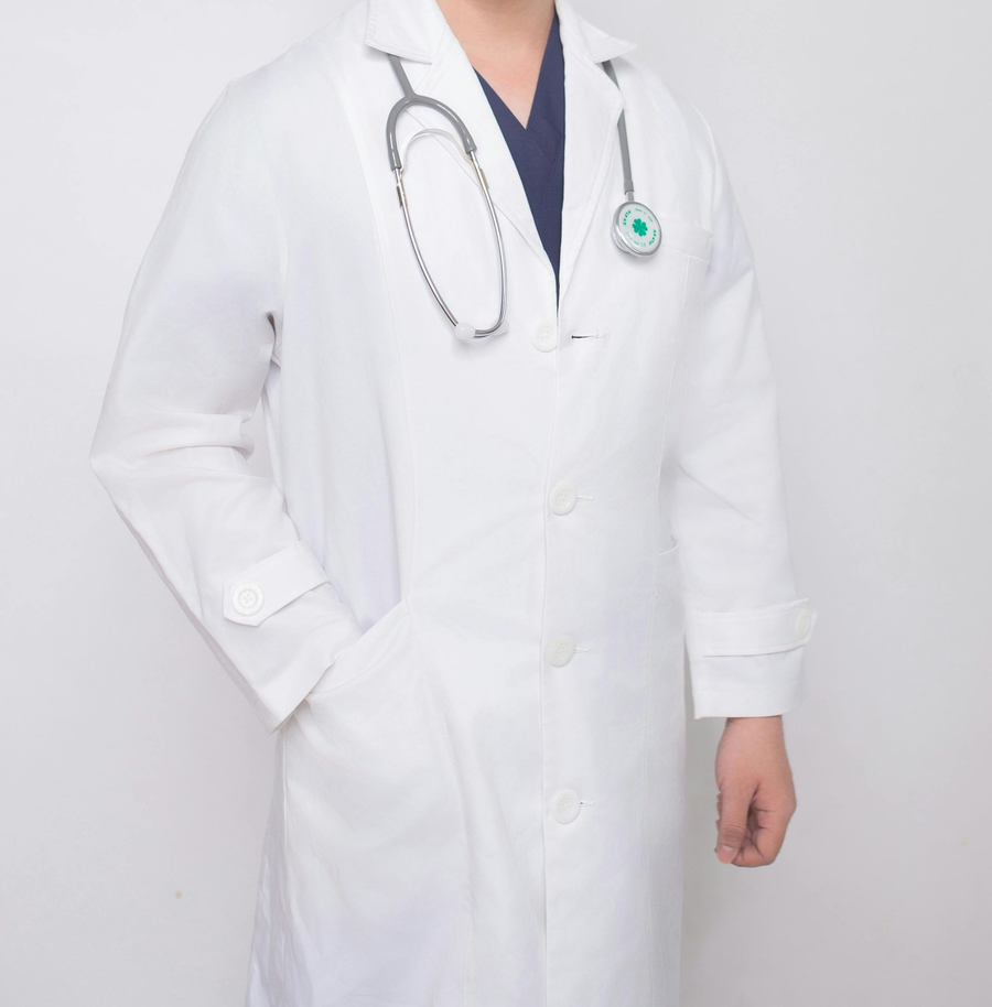 White lab coat with stethoscope on a doctor against a light gray background