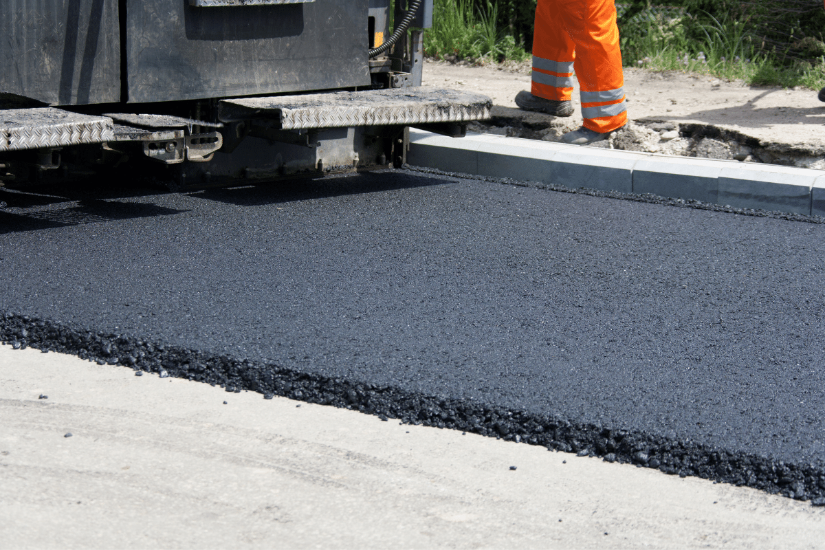 workers paving at road construction site