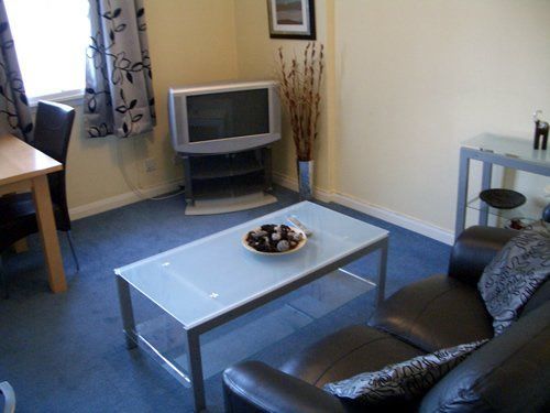 TV with centre table and sofa