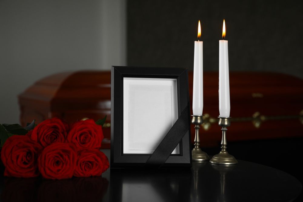 A Picture Frame , Candles And Red Roses — A Better Way Funerals in Hornsby, NSW
