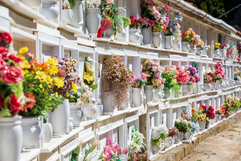 A Cemetery Filled With Lots Of Vases Filled With Flowers — A Better Way Funerals in Hornsby, NSW
