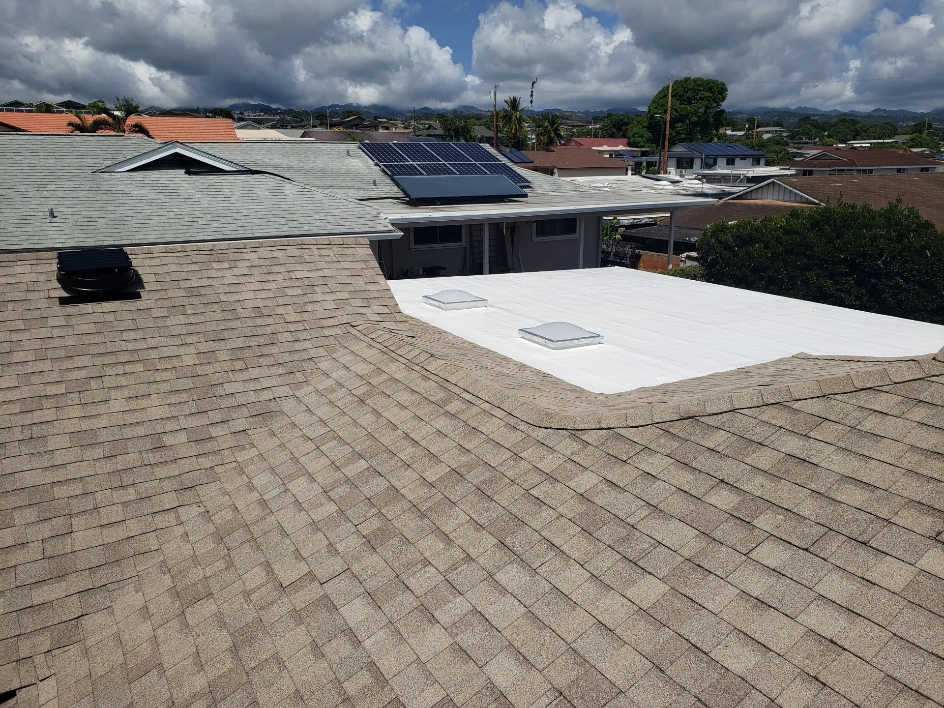 A roof with a white roof and a solar panel on it.