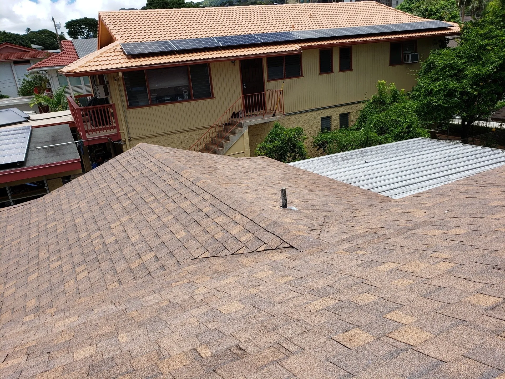 The roof of a house with solar panels on it