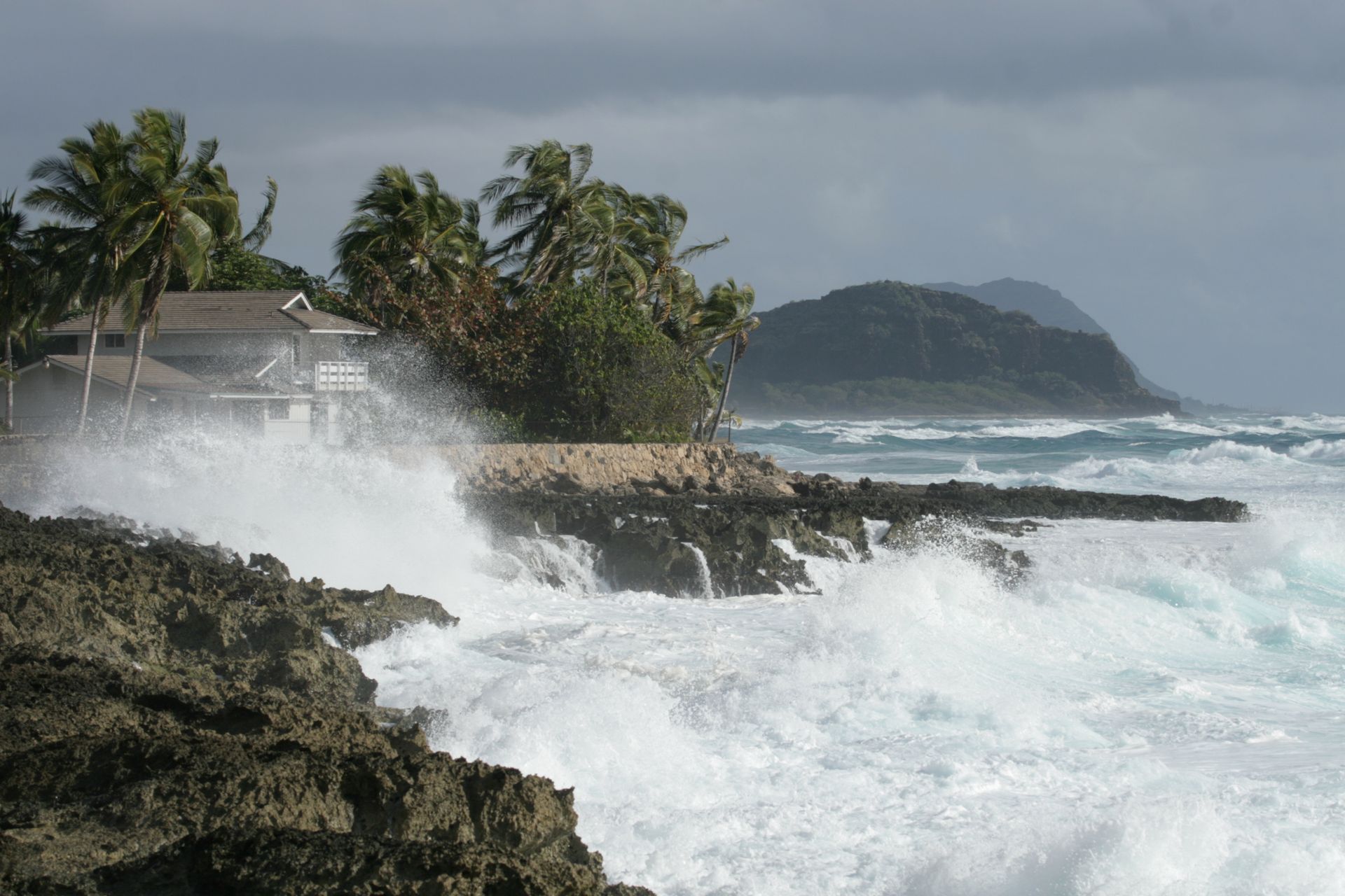 There are two skylights on the roof of a house.
