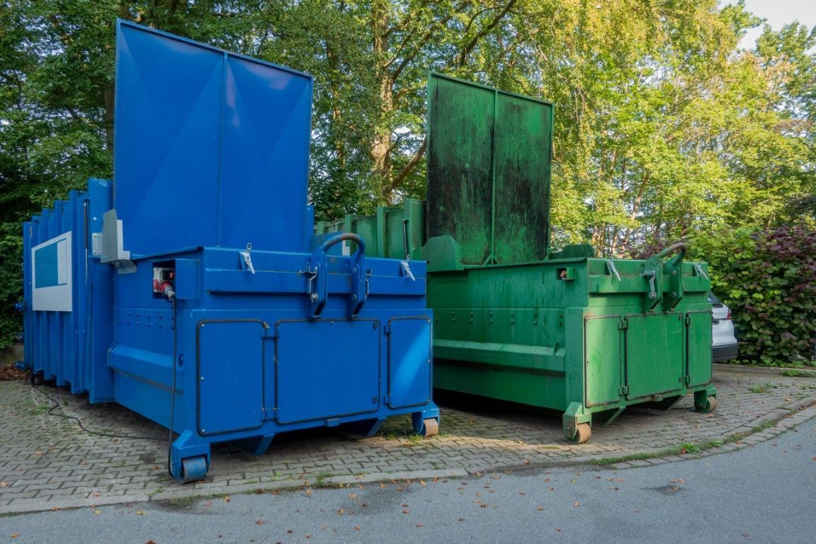 Two heavy-duty waste containers and dumpsters ready for delivery by Goldsboro Dumpster Rental in Goldsboro, North Carolina