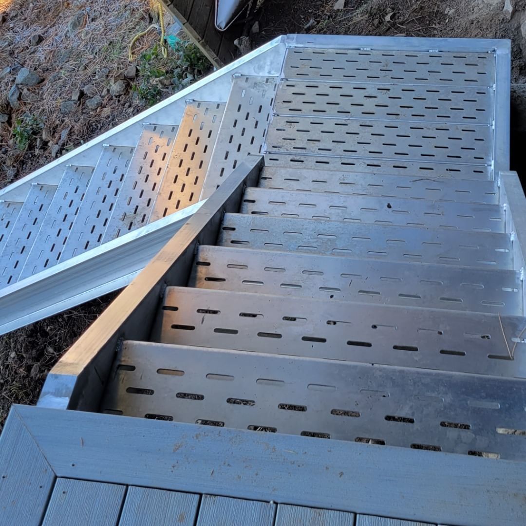 Metal outdoor stairs with perforated treads.
