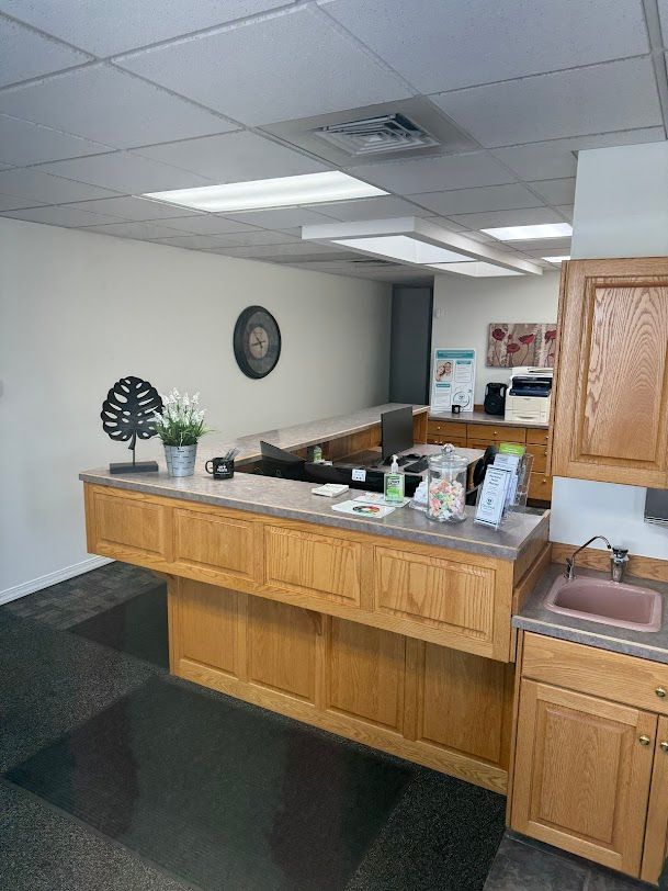 A kitchen with a wooden counter top and a sink.