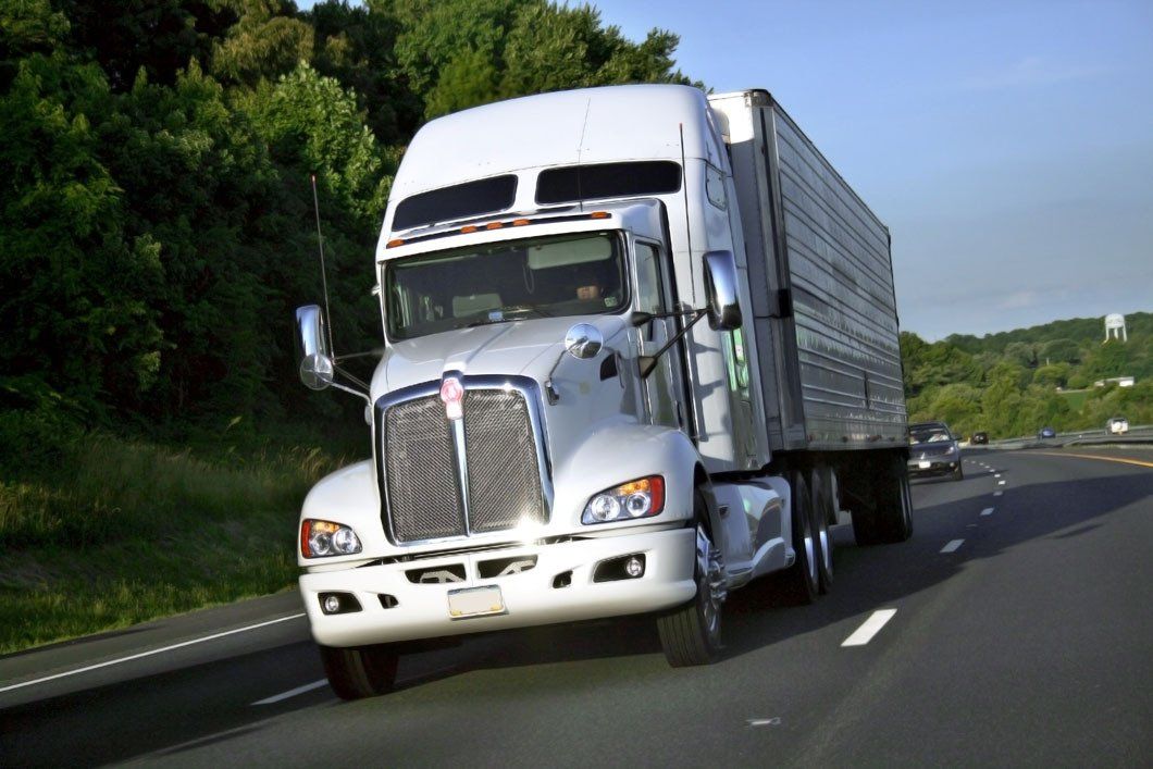 Truck with container on highway