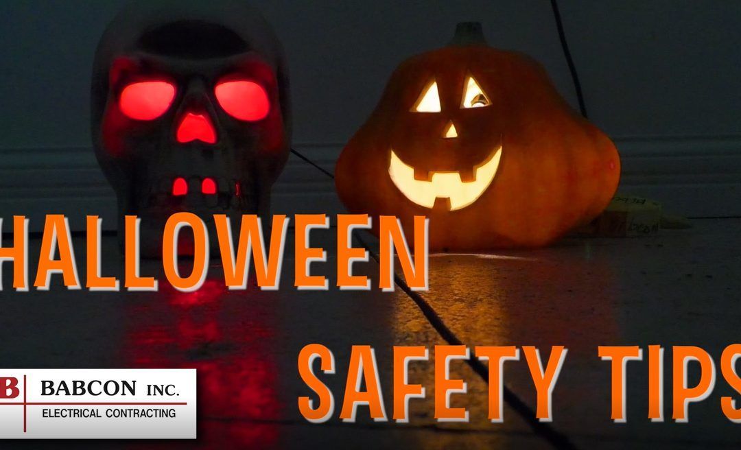 A skull and a pumpkin are lit up with the words halloween safety tips