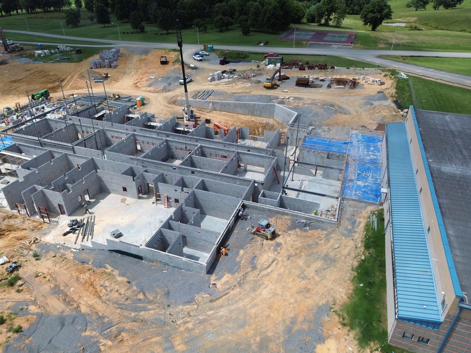 An aerial view of a large building under construction.