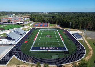 An aerial view of a football field with the word lakers on it