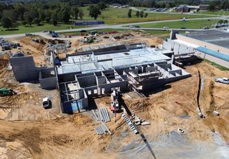 An aerial view of a large building under construction