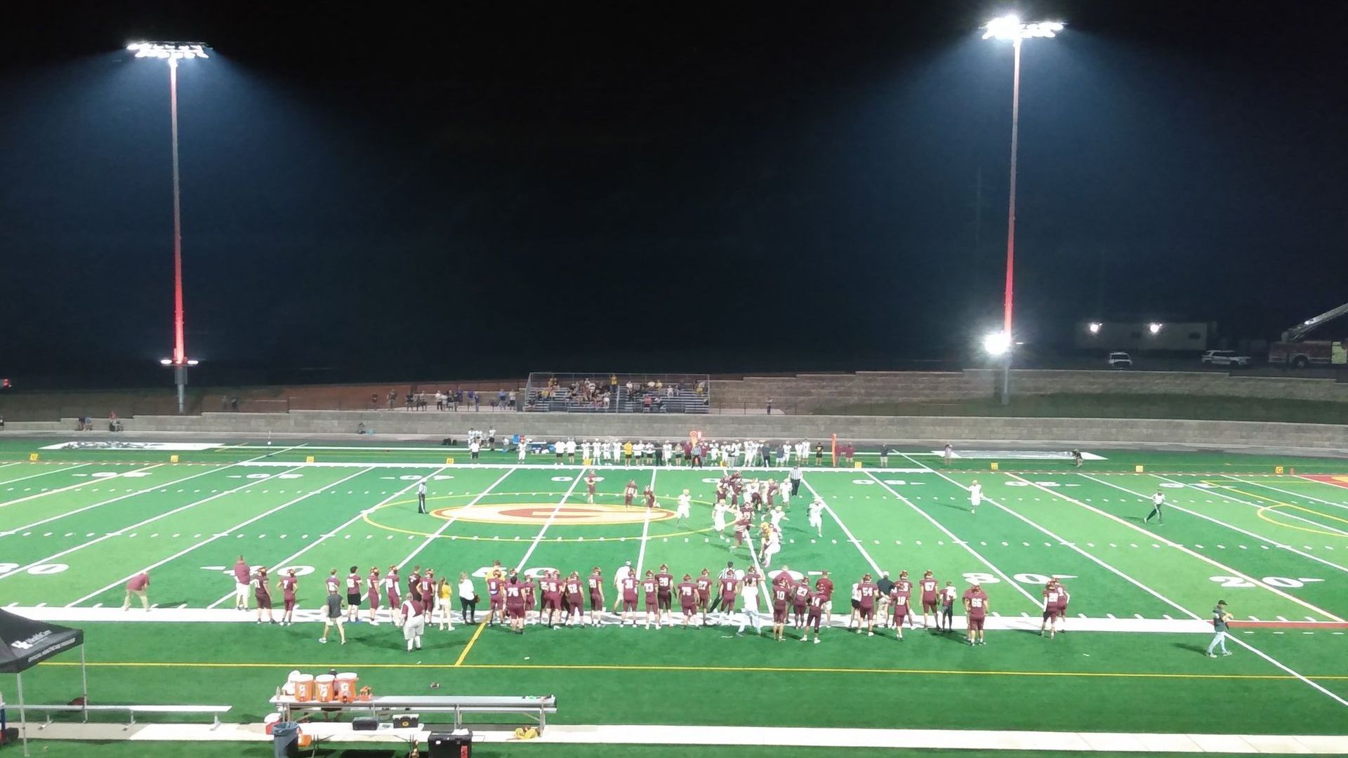 A football field with a track in front of it