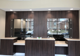 A room with wooden walls and a reception counter