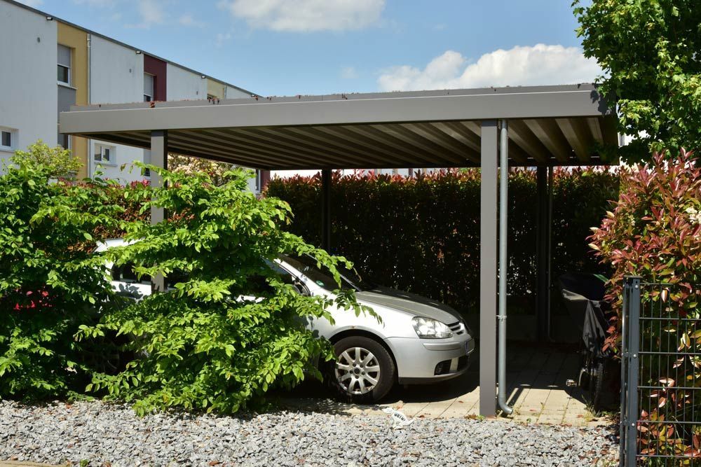 Metal Carport In Front Of A Residential Building — Custom Builder in Yamba, NSW