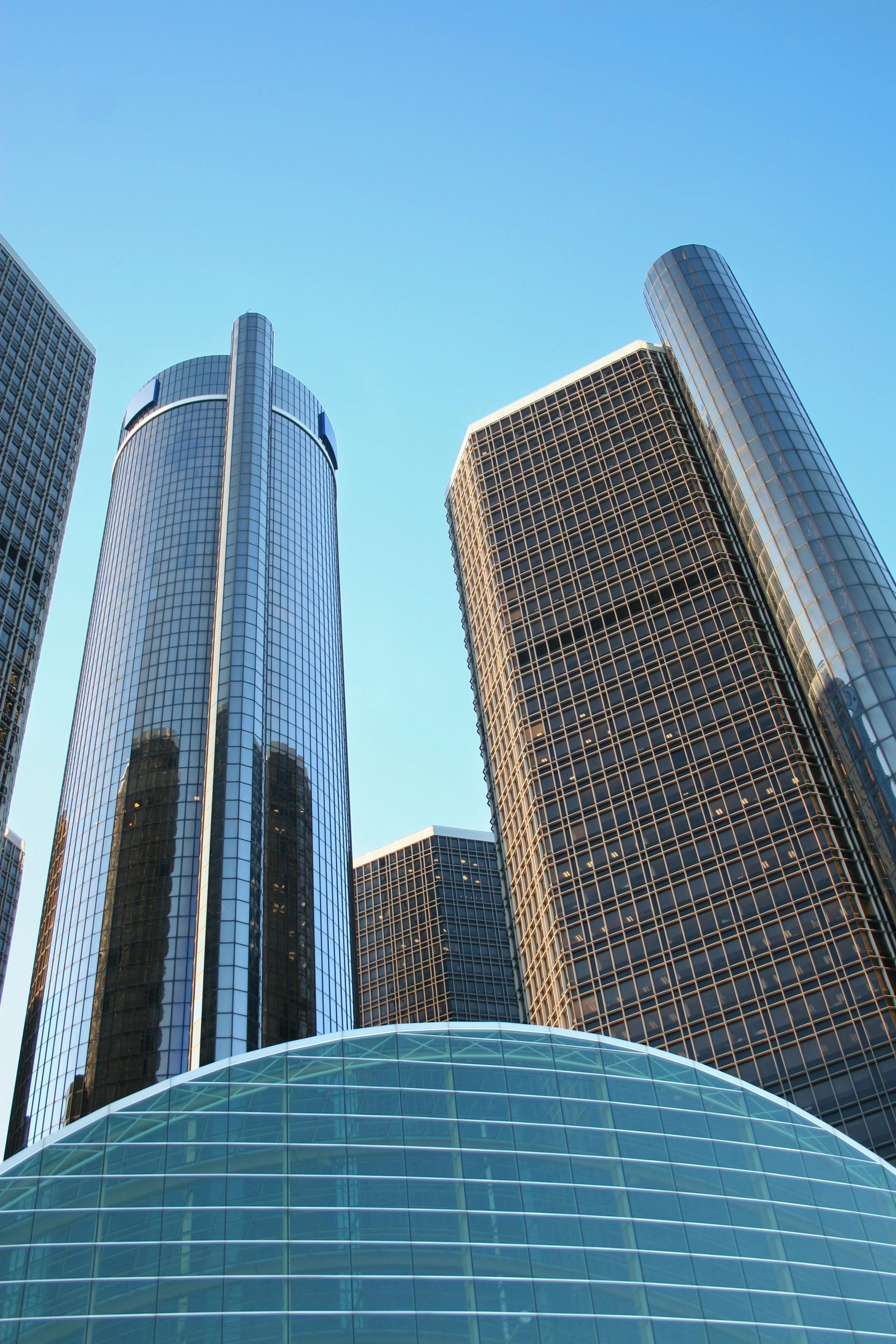 A group of tall buildings with a blue sky in the background