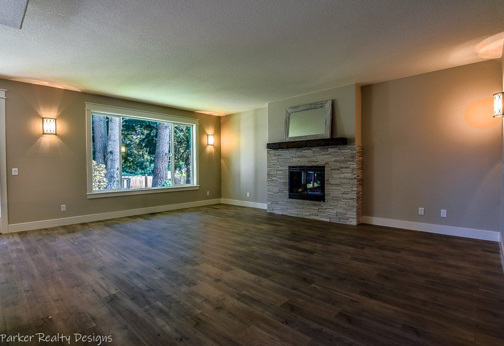 Beautiful stone gas fireplace with decorative mantel.