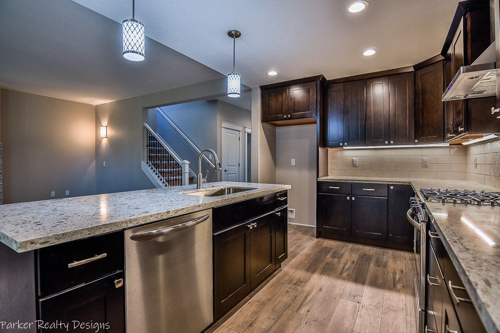 New construction. Large kitchen island with quartz counters.